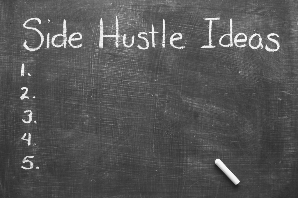 Chalk-board with the words "Side Hustle Ideas" written across the top and numbers 1 through 5 written down the left side.